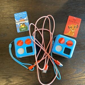 2 Yoto minis with sleeve protector and 2 cards